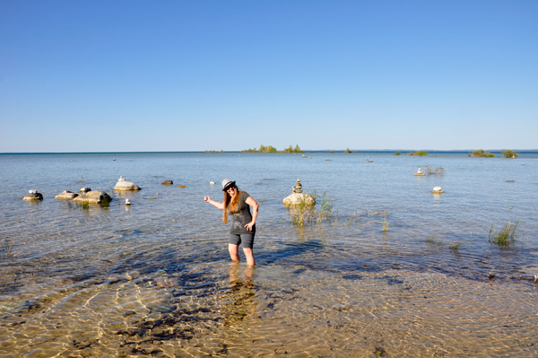 Karen Duquette walks in the water at Grand Traverse Bay